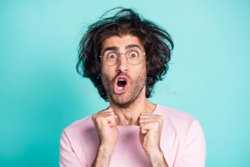 close-up-portrait-shocked-weird-hairdo-person-fists-yell-open-mouth-isolated-turquoise-color-background-204932863.jpg