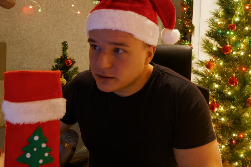Man in Santa Hat at Desk.png