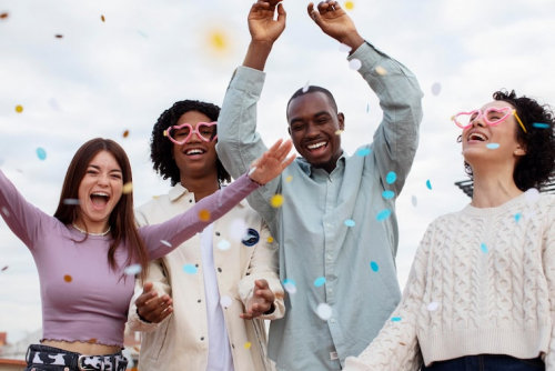 medium-shot-people-partying-with-confetti_23-2149128382.jpg